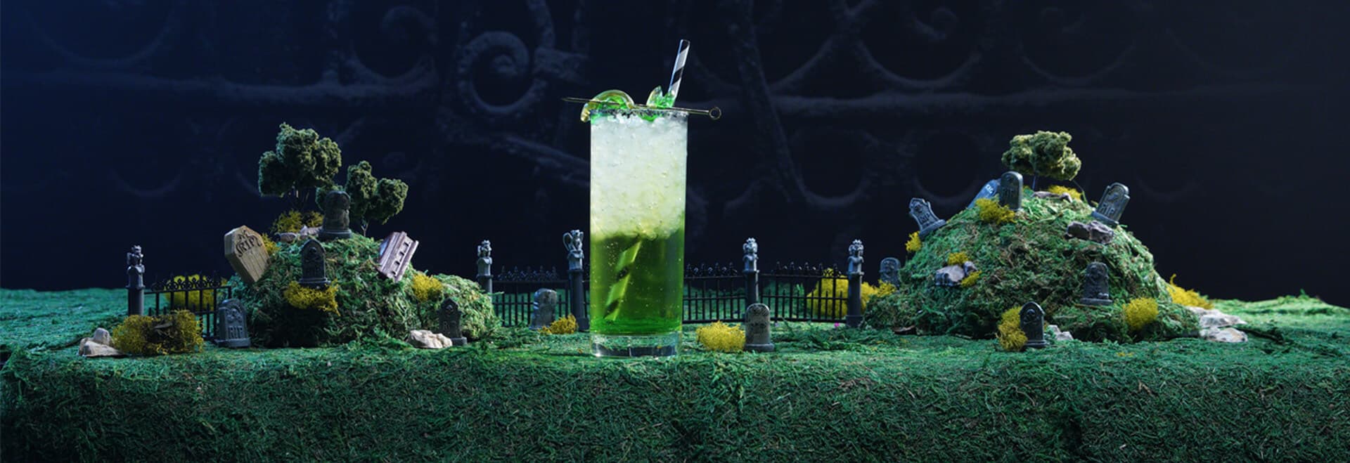an green color with gummy snakes decoration for vodka drink